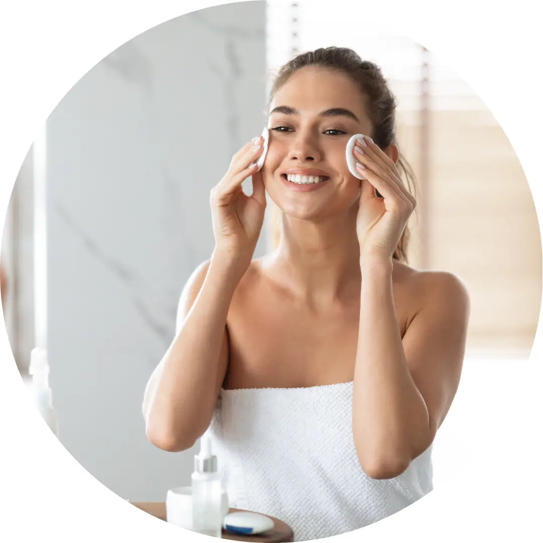 Woman using a flower water facial toner, hydrosol 